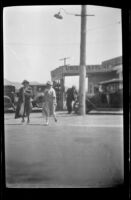 Mertie Whitaker and Zetta Witherby leaving a gas station, Carpinteria vicinity, about 1924