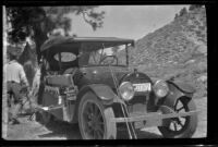 H. H. West's Cadillac 8 parked under a pine tree, Mono County, about 1920