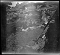 H. H. West Jr. sits on his camping bed, Mono County vicinity, 1929