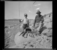H. H. West and his son pose with the trout they caught in Grant Lake, Mono County vicinity, 1929