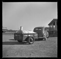 Forrest Whitaker's Ford and trailer parked at a rest stop, Little Lake, 1941