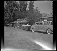 Forrest Whitaker's Ford and trailer parked at Paradise Camp, Bishop vicinity, 1941