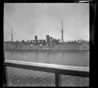 Battleship as seen from a ferry, San Francisco, 1900