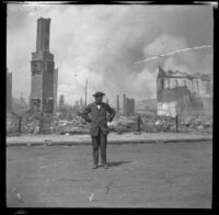 Guy West stands in front of a block destroyed by the San Francisco Earthquake and Fire, San Francisco, 1906
