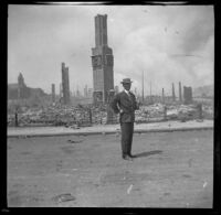 Franz Nelson stands in front of a block destroyed by the San Francisco Earthquake and Fire, San Francisco, 1906