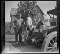 Charles "Mack" Bidwell, James Bidwell, Mary West, and Wilhelmina West stand by a car in front of the Bidwell's home, Shasta County vicinity, 1915
