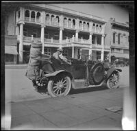 Wilfrid Cline, Jr. sitting in the backseat of H. H. West's parked Buick, Red Bluff, 1917