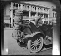 Wilfrid Cline, Jr. exiting H. H. West's parked Buick, Red Bluff, 1917