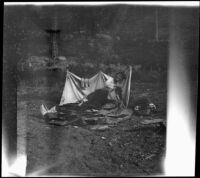 Wilfrid Cline, Jr. lounging on his camp bedding, Trinity County, 1917