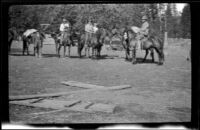 John Bidwell, Harry Schmitz, Wilfrid Cline, Jr., and Bidwell's neighbor readying to leave for Kosk Creek, Burney Falls vicinity, 1917