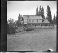 Burney Hotel and water trough, viewed at a distance, Burney, 1917