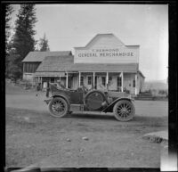 Wilfrid Cline, Jr. sits in a car during a stop at Desmond's general store, Burney, 1917