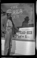 Harry Schmitz pointing to a sign, Reno, 1917