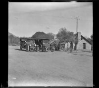 H. H. West's Buick and A. B. Schmitz's Moon parked in front of a motel in Willow Springs, Rosamond vicinity, 1914