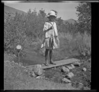 Elizabeth West posing with fish, June Lake vicinity, 1914