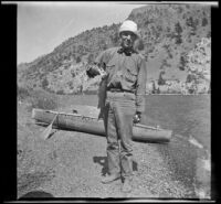 Howard Buttress posing with a fish, June Lake vicinity, 1914