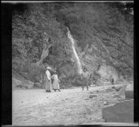 Mary A. West, Isabelle Smith and Dave F. Smith standing near Bridal Veil Falls just off the roadside, Eldorado National Forest, 1913