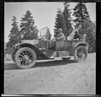 Mary A. West and Nella A. West pose in H. H. West's Buick while traveling by Lake Tahoe, Lake Tahoe, 1913
