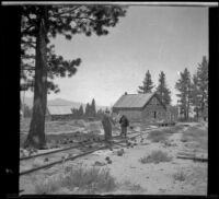 Mary A. West and Isabelle Smith walk along railroad tracks to the Mono Mills general store, Mono Lake vicinity, 1913