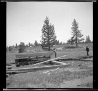 Lumber workers stand near piles of lumber, Mono Lake vicinity, 1913