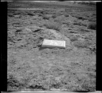 Gravestone for John Anderson lying in the ground near Casa Diablo Hot Springs, Mammoth Lakes vicinity, 1913