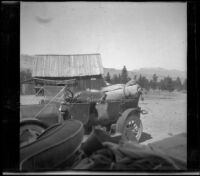 Dave F. Smith's EMF parked outside a barn, Mammoth Lakes, 1913