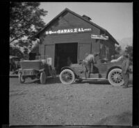 Pete Aigner filling the tank of H. H. West's Buick at his garage, Lone Pine, 1913