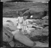 Elizabeth and Frances West stand on the beach at La Jolla with Glen Velzy in the background, San Diego, 1909