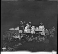 Elizabeth West, Al Schmitz, Mary A. West, Frances West, Irene Schmitz and Kate Schmitz gathered around their camp dining table, Warner Springs vicinity, about 1915
