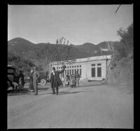 John Lemberger waves as he and members of the Schmitz and West families leave Power Plant No. 1, San Francisquito Canyon, [about 1917]