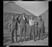 H. H. West Jr. poses with the men from his tent at Camp San Luis Obispo, San Luis Obispo, 1942