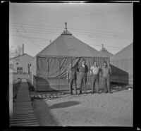 H. H. West Jr. poses with the men from his tent at Camp San Luis Obispo, San Luis Obispo, 1942