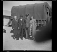 H. H. West poses with his wife and children at the Southern Pacific Railroad depot, San Luis Obispo, 1942