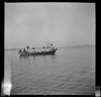 Man, woman, and two children on a boat, San Pedro, about 1910