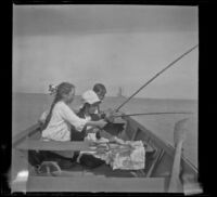 Frances West, Elizabeth West, and Wilfrid Cline fishing on a boat, San Pedro, about 1910