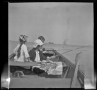 Frances West, Elizabeth West, and Wilfrid Cline on a boat, San Pedro, about 1910