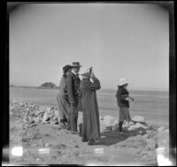 Bessie Velzy, Glen Velzy, Frances West, Mrs. George M. West and Elizabeth West stand on the shore and look towards the water, Los Angeles, about 1910