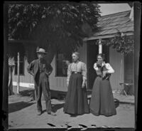 Charlie Mertz, Kate Mertz and and Frances Nichols standing outside their home at Nichols Ranch, Santa Ana, about 1899