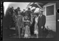 H. H. West's family poses in front of Wayne West's home, Santa Ana, about 1932