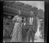 Wilson West and Eleanor West pose with their son, Richard D. West in front of Wayne West's home, Santa Ana, 1933