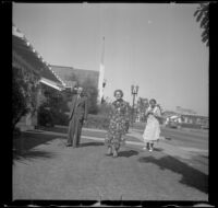 Wayne West stands on his front lawn with his wife and mother-in-law, Santa Ana, 1937
