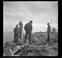 Richard Siemsen, Dottie Siemsen, Al Siemsen and Wayne West stand on the ocean front, Newport Beach, 1941