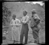 Clarence McCabe, F. O. Nelson and Game Warden Pritchard stand around while attending the Rubber Men's Picnic, Santa Monica Canyon, about 1908