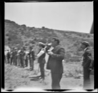 Roy Garland drinks a beer at the Rubber Men's Picnic, Santa Monica Canyon, about 1908