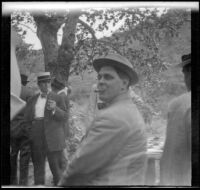 Leon T. Shettler sits and turns to look to the camera, Santa Monica Canyon, about 1908