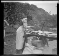 Vincent Loos helping with the barbecue, Santa Monica Canyon, about 1908