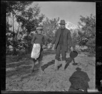 Wilfrid Cline, Jr. and Charles Stavnow pose in a clearing near Taboose Creek, Big Pine vicinity, about 1918