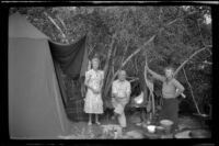 Mertie West and Forrest and Agnes Whitaker stand in their campsite at Rock Creek, Mammoth Lakes vicinity, 1940