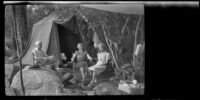 Mertie West and Forrest and Agnes Whitaker sit at their campsite at Rock Creek, Mammoth Lakes vicinity, 1940