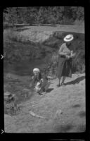 Mertie West and Agnes Whitaker on the banks of Glass Creek, Mammoth Lakes vicinity, 1940